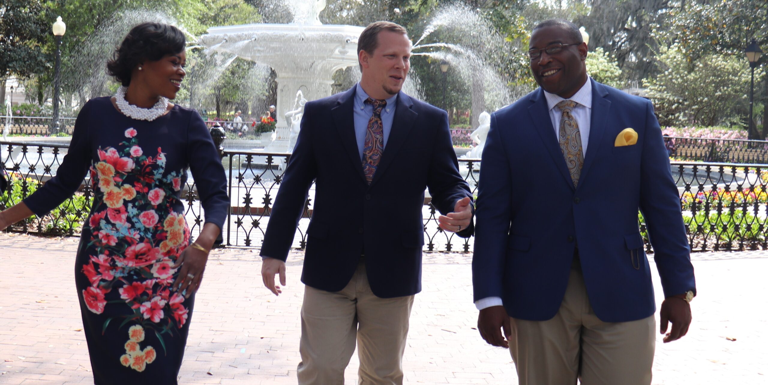 Attorney Christopher K. Middleton talking together in front of a fountain. | Image is used for the Contact Us above-the-footer on the website of Cox, Rodman, & Middleton, LLC
